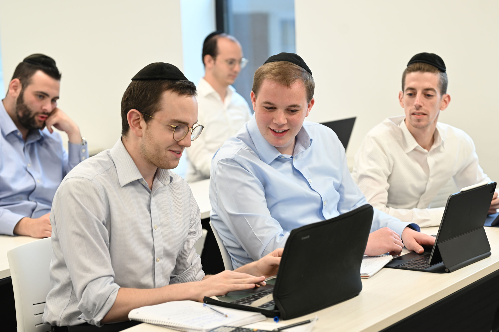 Male students working together during class