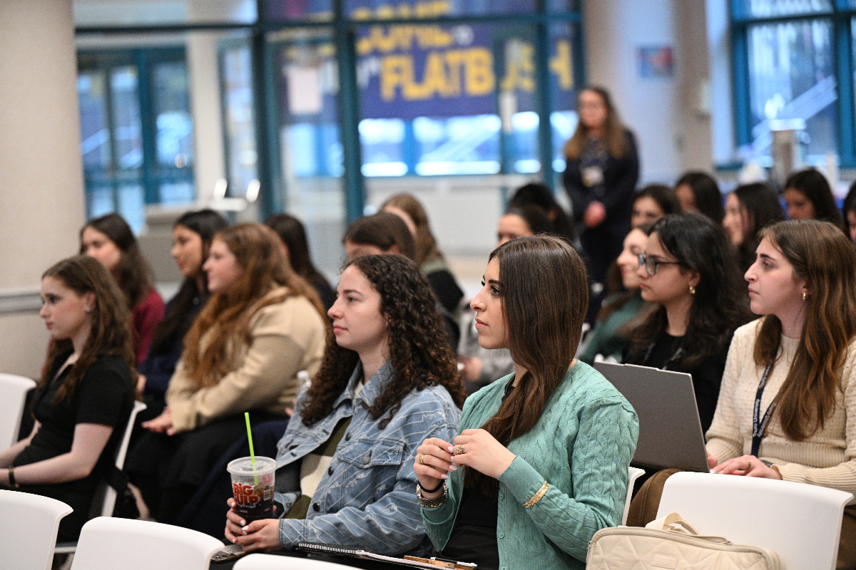 Students at Lander College in Flatbush listen to a presentation about graduate programs at Touro\'s School of Health Sciences.