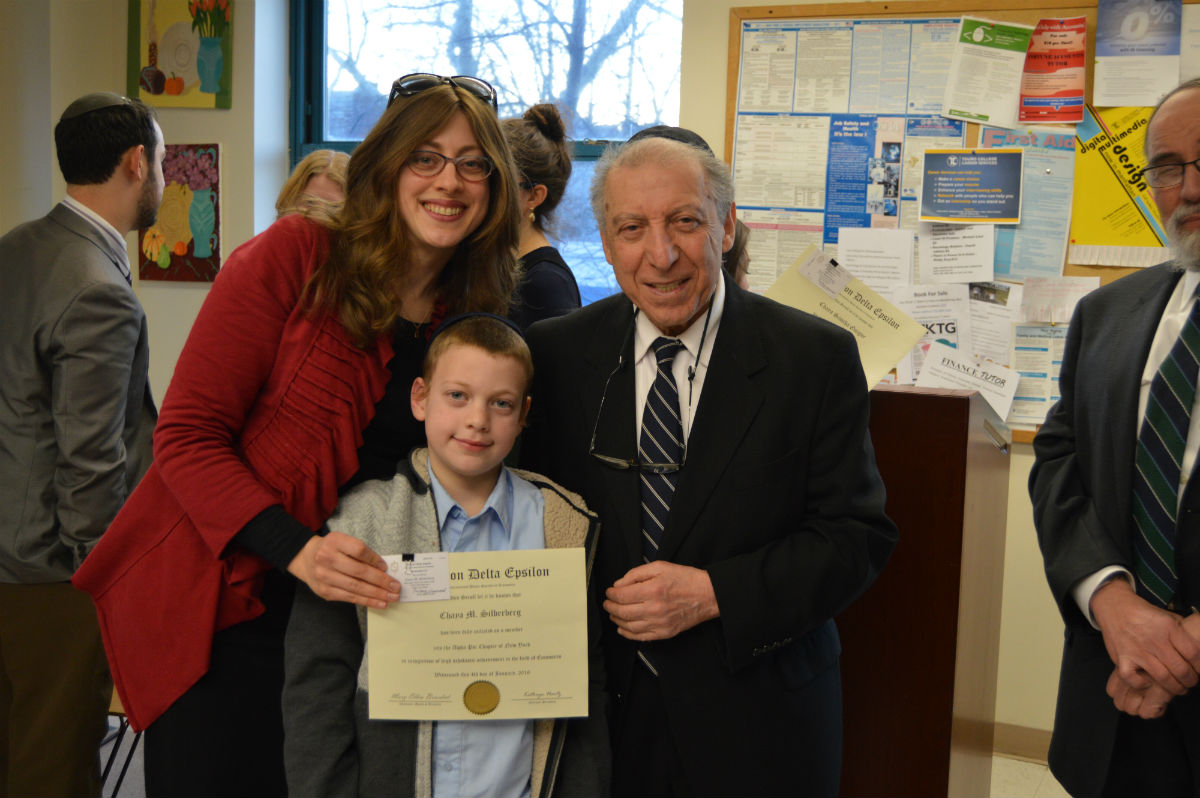 Chaya Silberberg, with her son Yaakov and Dr. Michael Szenberg, Touro’s distinguished professor of economics and business and the chair of the Economics and Business department at the Lander College of Arts & Sciences-Flatbush, was one of 50 Touro students inducted into the Omicron Delta Epsilon International Honor Society in Economics.